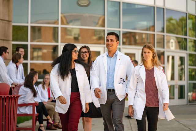 Aequitas Health fellows heading to a community health project — the kind of student-led action the honor society was built to recognize